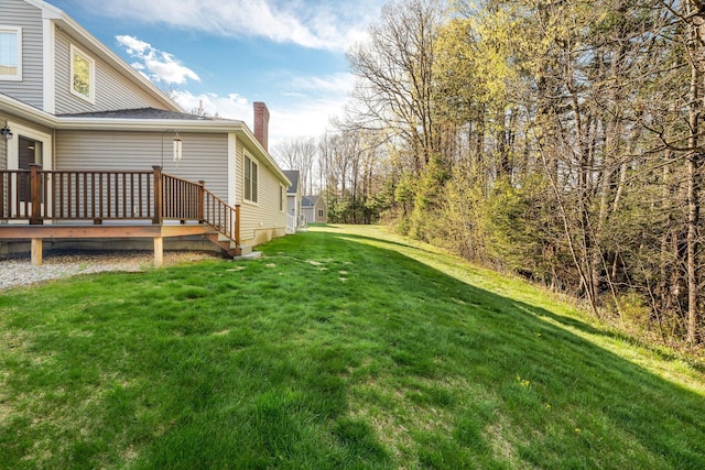 view of yard with a deck