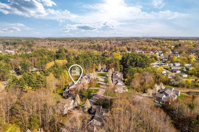 bird's eye view featuring a forest view and a residential view