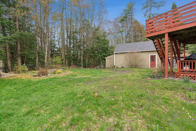 178 Bradley St, Saco, ME 04072 - view of green lawn with a deck, an outbuilding, and a shed
