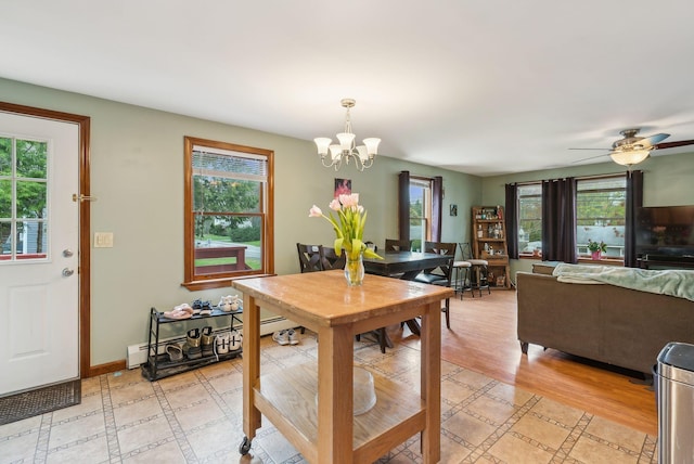178 Bradley St, Saco, ME 04072 - dining room featuring healthy amount of natural light, a chandelier, light wood finished floors, and ceiling fan