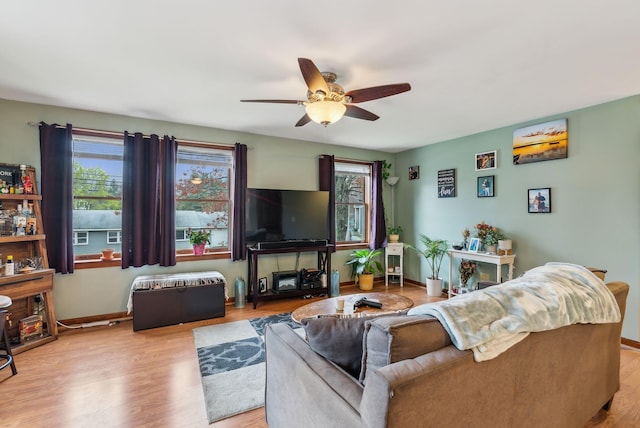 178 Bradley St, Saco, ME 04072 - living area featuring a ceiling fan, healthy amount of natural light, wood finished floors, and baseboards