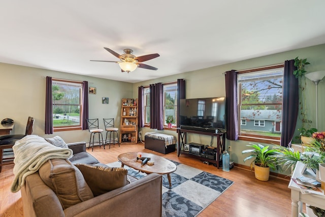 178 Bradley St, Saco, ME 04072 - living area featuring a ceiling fan, light wood-style flooring, a baseboard heating unit, and baseboards