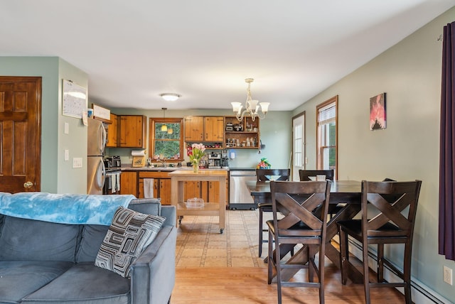 178 Bradley St, Saco, ME 04072 - living area featuring a chandelier, light wood-style flooring, and baseboard heating