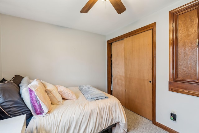 178 Bradley St, Saco, ME 04072 - bedroom featuring light colored carpet, a closet, baseboards, and a ceiling fan