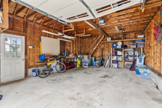 178 Bradley St, Saco, ME 04072 - garage with a garage door opener and wooden walls