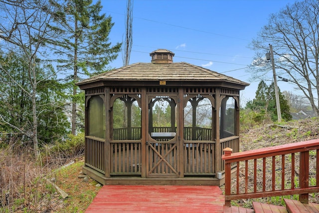 wooden terrace with a gazebo