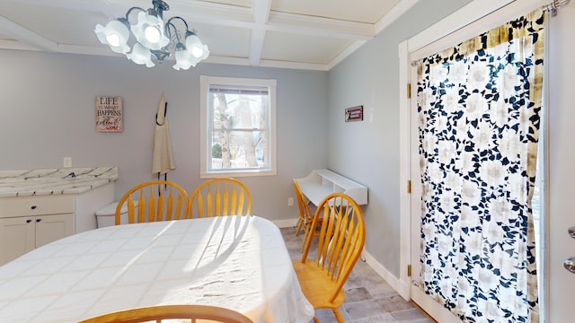 dining room featuring beamed ceiling, an inviting chandelier, baseboards, and coffered ceiling