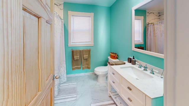 full bath with toilet, a shower with shower curtain, marble finish floor, and vanity