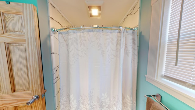 bathroom featuring curtained shower
