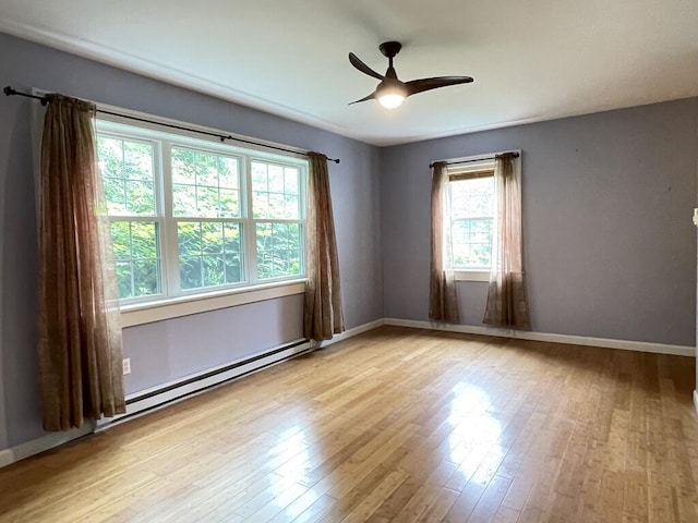 45 Seaview Ter, Belfast, ME 04915 - empty room with ceiling fan, wood finished floors, and a baseboard heating unit