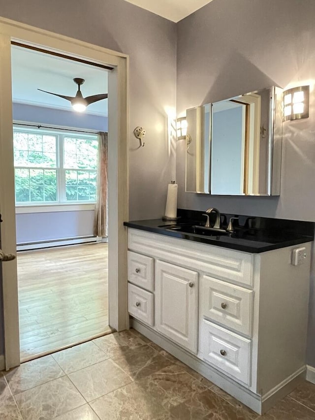 45 Seaview Ter, Belfast, ME 04915 - bathroom featuring a ceiling fan, vanity, and a baseboard heating unit