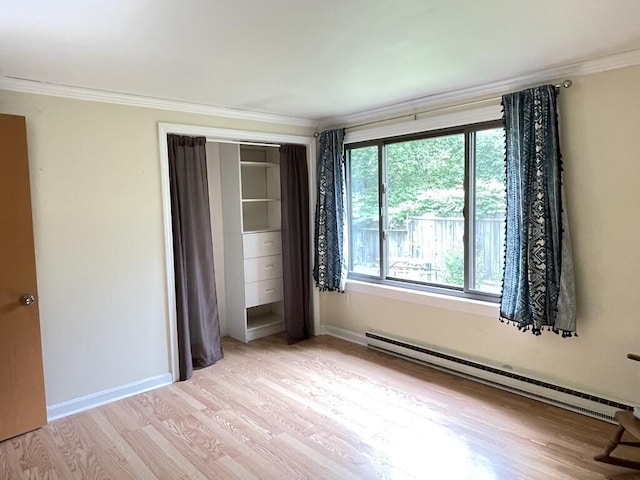 45 Seaview Ter, Belfast, ME 04915 - unfurnished bedroom with a baseboard radiator, light wood finished floors, ornamental molding, and a closet