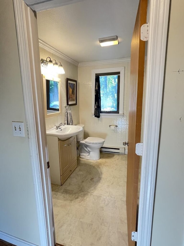 45 Seaview Ter, Belfast, ME 04915 - bathroom with vanity, a baseboard heating unit, and crown molding