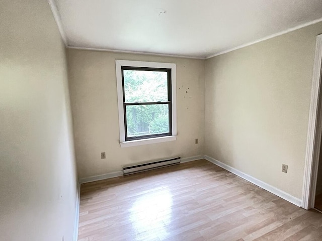 45 Seaview Ter, Belfast, ME 04915 - empty room featuring a baseboard radiator, light wood-style flooring, and ornamental molding
