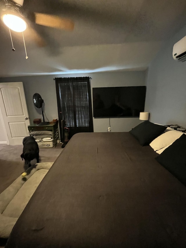 924 Great Pond Rd, Great Pond, ME 04408 - carpeted bedroom with a wall unit AC and ceiling fan