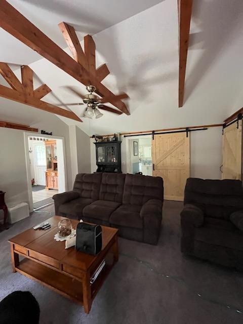 924 Great Pond Rd, Great Pond, ME 04408 - living area with a barn door, carpet floors, and ceiling fan