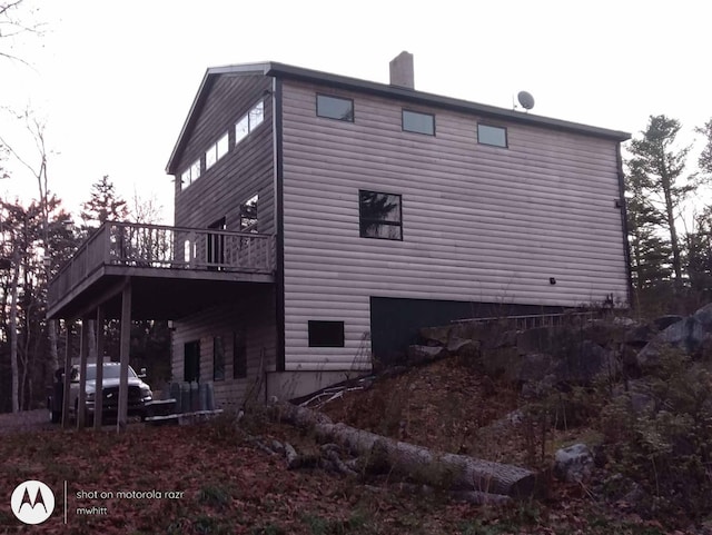 29 Punkin Hill Rd, South Thomaston, ME 04858 - view of home's exterior with a deck, a chimney, and log veneer siding