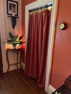 17 Boynton St, Eastport, ME 04631 - bathroom with wood finished floors and a shower with curtain