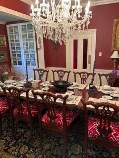 17 Boynton St, Eastport, ME 04631 - dining room with a chandelier and crown molding