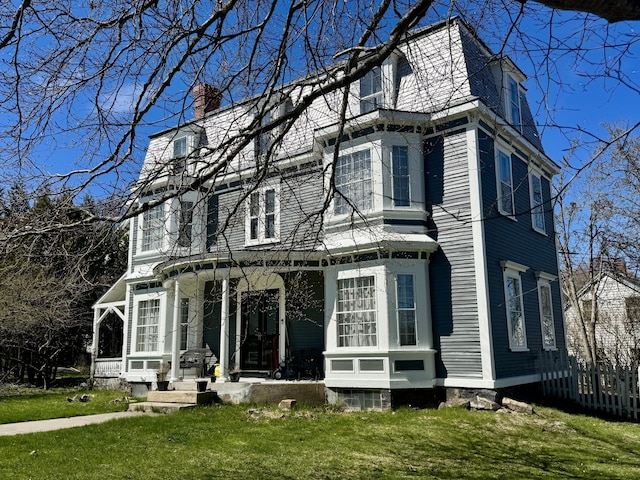 17 Boynton St, Eastport, ME 04631 - view of home's exterior with a chimney
