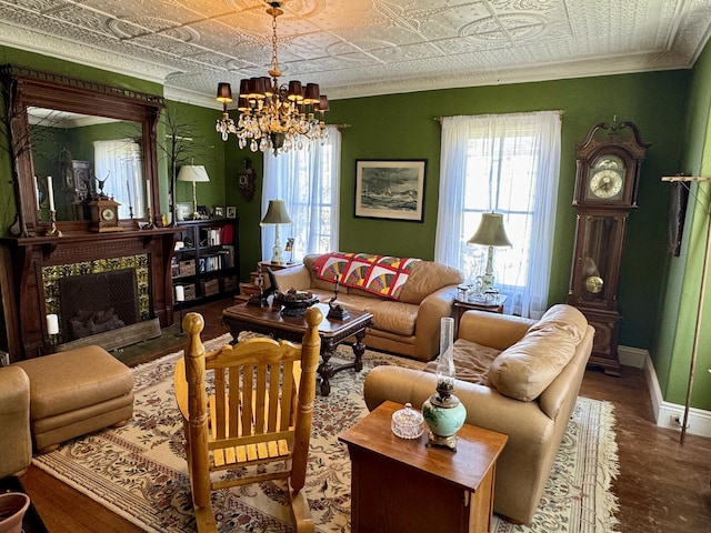 17 Boynton St, Eastport, ME 04631 - living room with an ornate ceiling, plenty of natural light, a chandelier, wood finished floors, and crown molding
