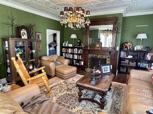 17 Boynton St, Eastport, ME 04631 - living area with an ornate ceiling, a chandelier, a high end fireplace, wood finished floors, and ornamental molding