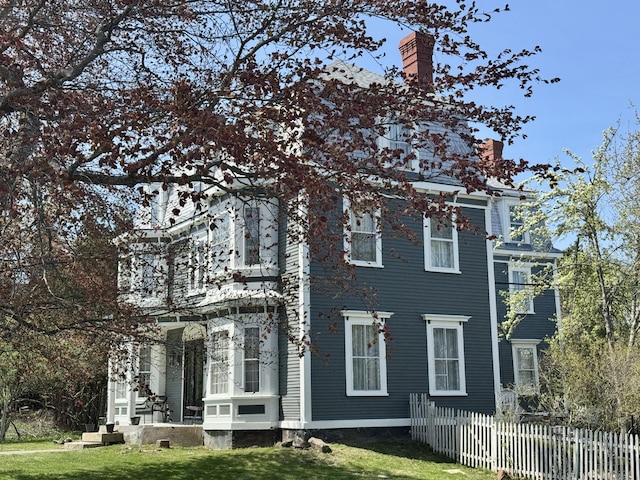 17 Boynton St, Eastport, ME 04631 - view of side of home with a chimney