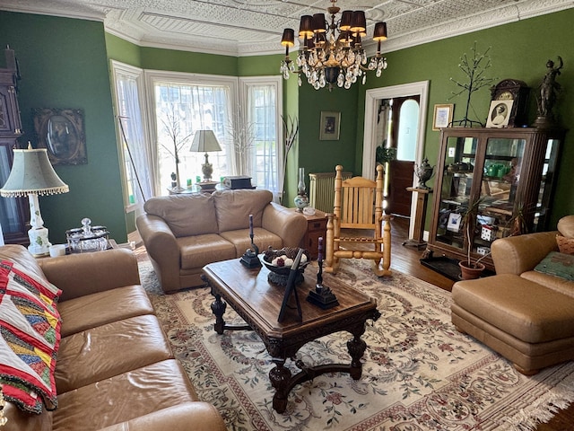 17 Boynton St, Eastport, ME 04631 - living room with a chandelier, wood finished floors, ornamental molding, and an ornate ceiling