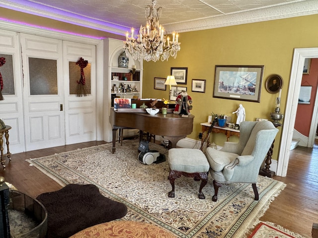 17 Boynton St, Eastport, ME 04631 - office featuring a chandelier, wood finished floors, baseboards, and built in shelves