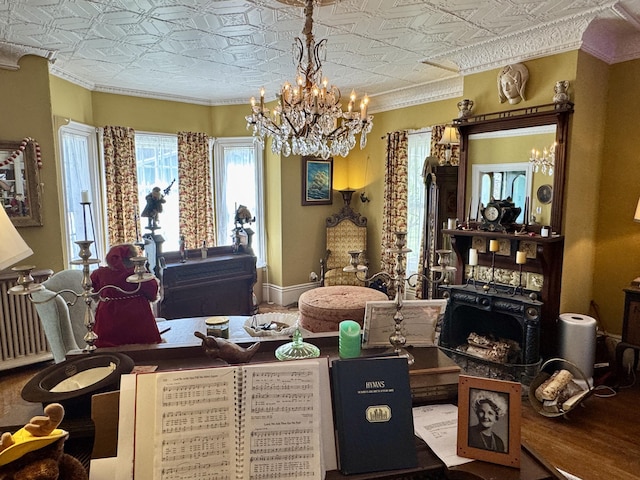 17 Boynton St, Eastport, ME 04631 - dining room with a chandelier, an ornate ceiling, crown molding, and baseboards