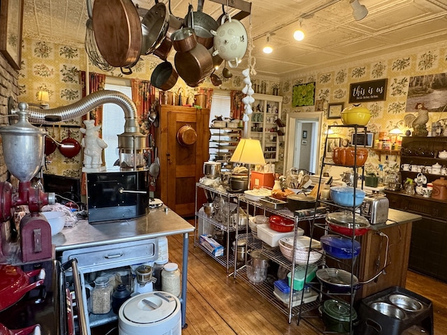 17 Boynton St, Eastport, ME 04631 - kitchen with wood-type flooring, wallpapered walls, and an ornate ceiling