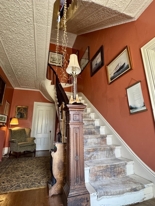 17 Boynton St, Eastport, ME 04631 - stairs featuring wood finished floors and ornamental molding