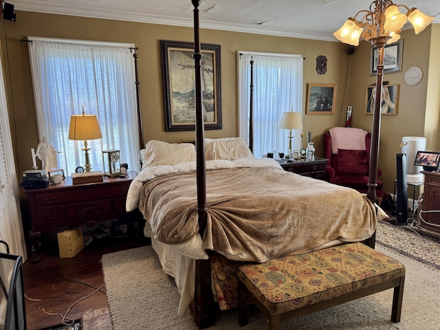 17 Boynton St, Eastport, ME 04631 - bedroom featuring multiple windows, ornamental molding, wood finished floors, and a chandelier