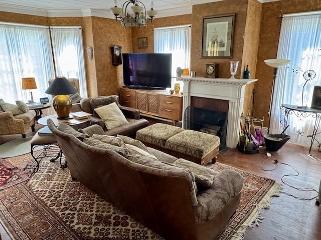 17 Boynton St, Eastport, ME 04631 - living area with hardwood / wood-style floors, ornamental molding, a chandelier, and a fireplace