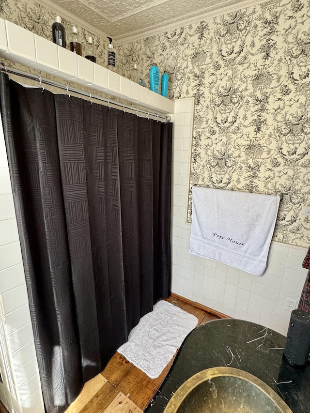 17 Boynton St, Eastport, ME 04631 - bathroom featuring wallpapered walls and a wainscoted wall