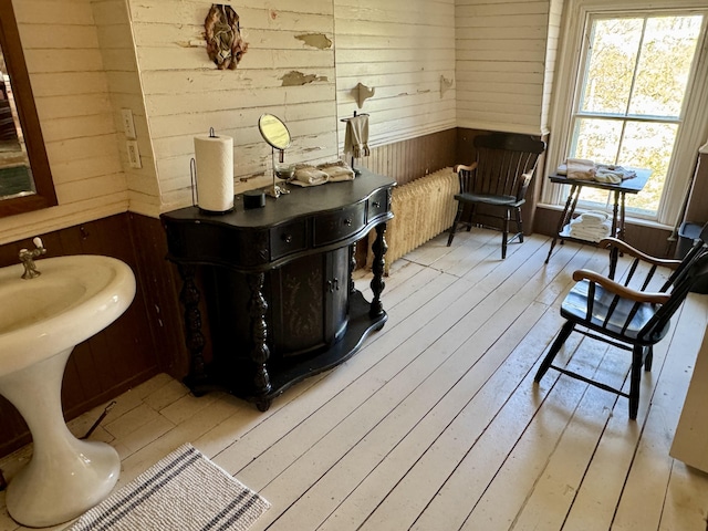 17 Boynton St, Eastport, ME 04631 - bathroom with wooden walls and hardwood / wood-style flooring