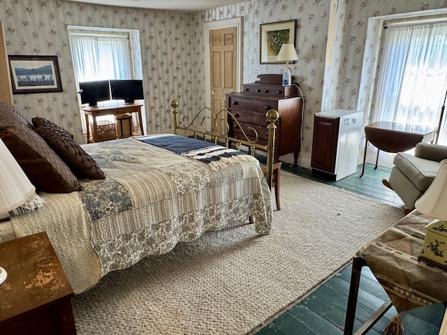 17 Boynton St, Eastport, ME 04631 - bedroom with wallpapered walls and wood finished floors