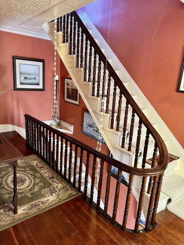 17 Boynton St, Eastport, ME 04631 - stairs featuring hardwood / wood-style flooring and baseboards