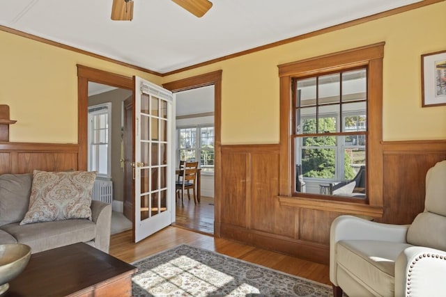 47 Atlantic Ave, Boothbay Harbor, ME 04538 - interior space featuring radiator heating unit, wainscoting, and wood finished floors