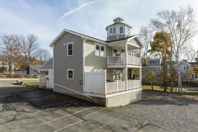 47 Atlantic Ave, Boothbay Harbor, ME 04538 - rear view of house featuring a balcony