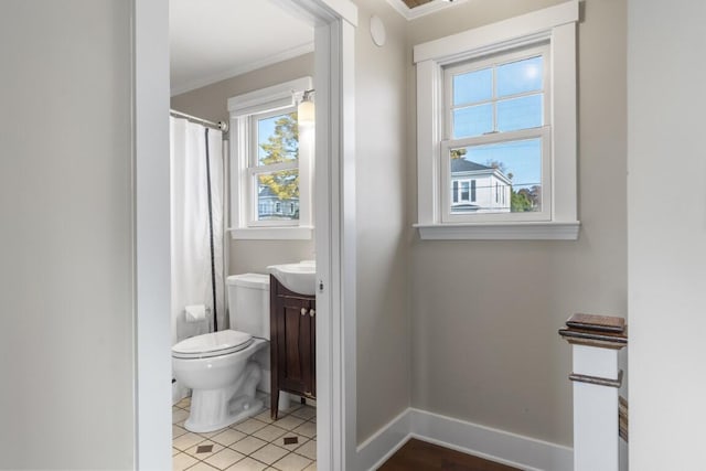 47 Atlantic Ave, Boothbay Harbor, ME 04538 - bathroom featuring crown molding, vanity, plenty of natural light, and toilet