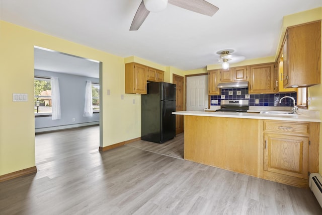 84 Old Carriage Rd Unit 84, Auburn, ME 04210 - kitchen with freestanding refrigerator, electric stove, a ceiling fan, a baseboard heating unit, and under cabinet range hood