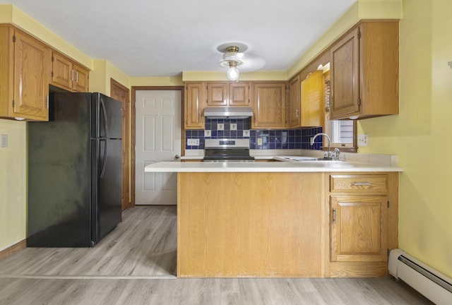 84 Old Carriage Rd Unit 84, Auburn, ME 04210 - kitchen featuring freestanding refrigerator, a baseboard heating unit, stainless steel range with electric cooktop, a peninsula, and light countertops