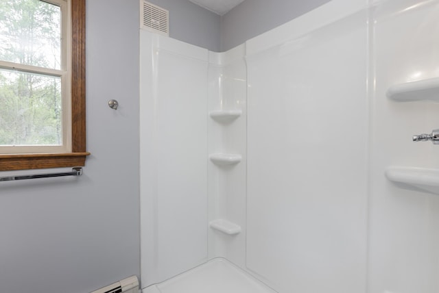 84 Old Carriage Rd Unit 84, Auburn, ME 04210 - bathroom featuring plenty of natural light, a shower, and baseboard heating