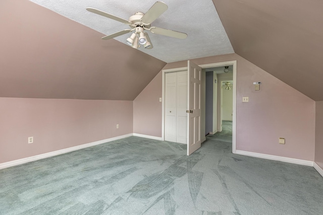 84 Old Carriage Rd Unit 84, Auburn, ME 04210 - additional living space featuring carpet flooring, a ceiling fan, vaulted ceiling, and a textured ceiling