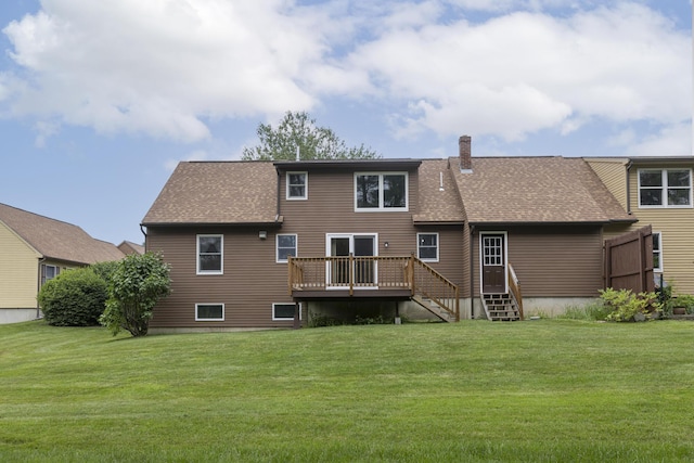 84 Old Carriage Rd Unit 84, Auburn, ME 04210 - back of property with a deck, a lawn, and roof with shingles