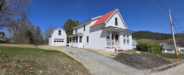 394 Linnell St, Rumford, ME 04276 - view of front of property with asphalt driveway, an outbuilding, and metal roof