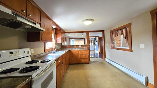 394 Linnell St, Rumford, ME 04276 - kitchen featuring electric stove, baseboard heating, under cabinet range hood, a sink, and brown cabinetry