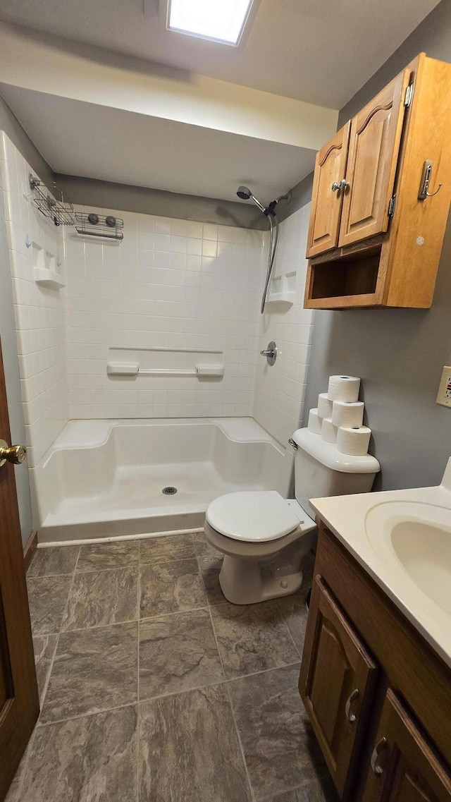 394 Linnell St, Rumford, ME 04276 - bathroom featuring a shower, toilet, and vanity