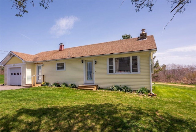 433 N Union Rd, Union, ME 04862 - single story home with a garage, a chimney, and a front lawn